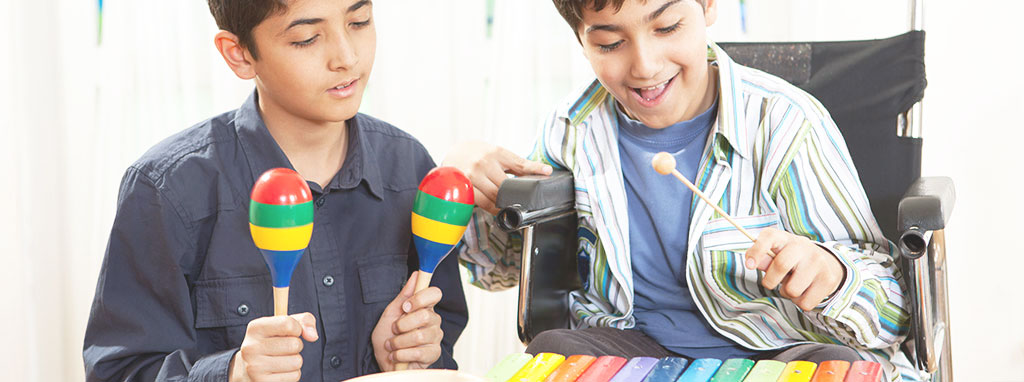 Music Therapy at Liberty POST | Two boys playing maracas and xylophone